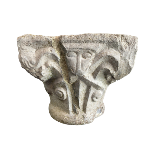 Romanesque capital decorated with masks.
