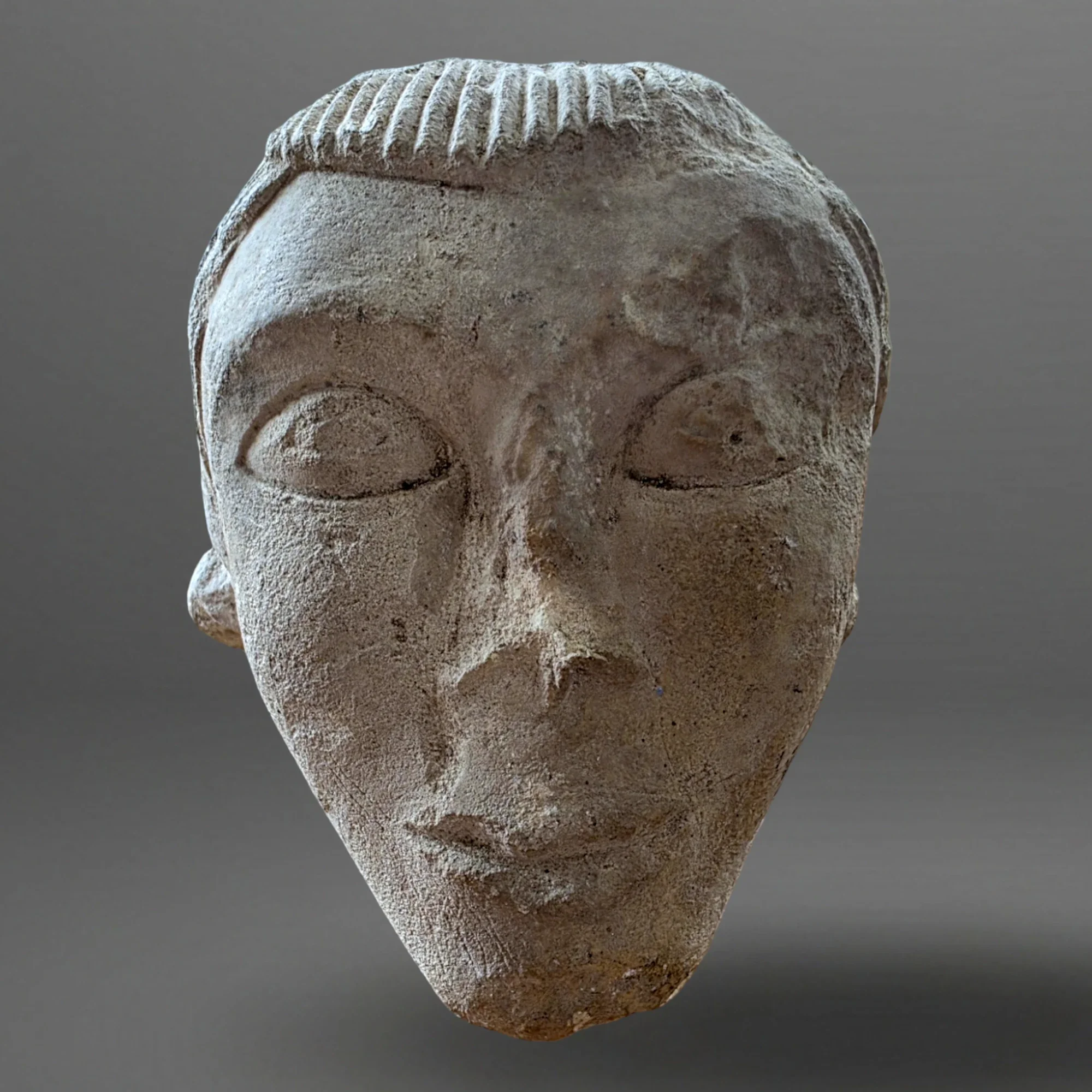 Romanesque mask – Cornice element. Oise Valley. View number 2